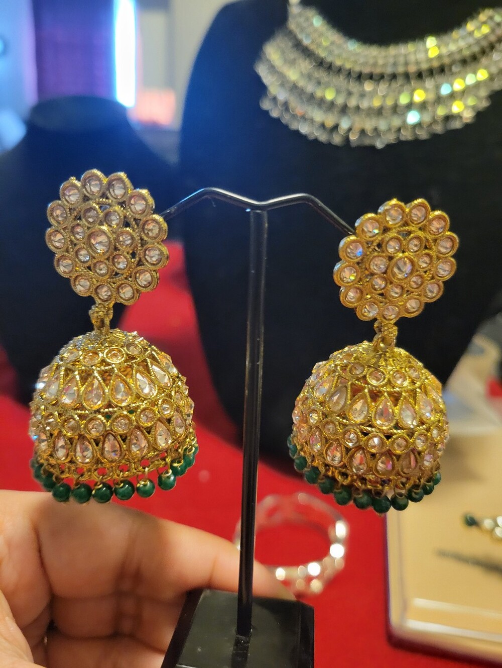 Gold and Green Jhumka Earrings with Kundan Detailing